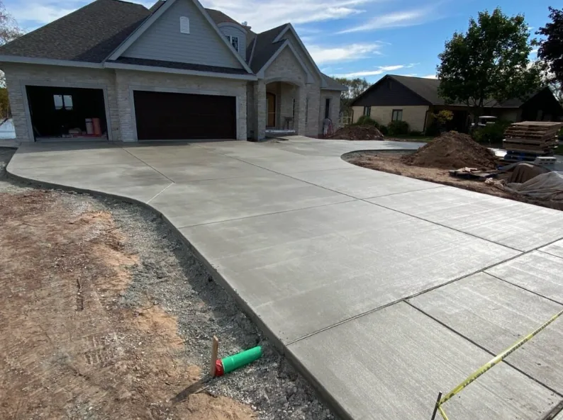 New concrete driveway poured and finished at an Oklahoma City home under construction